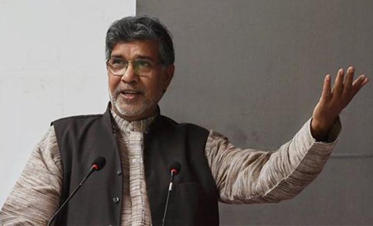 Kailash Satyarthi reacts as he talks to the media at his office in New Delhi on winning the Nobel Peace Prize for 2014